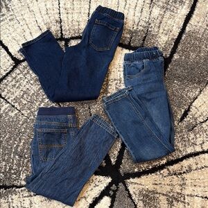 Kids pull on blue jeans